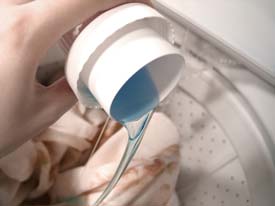 Putting laundrey detergent into a washing machine